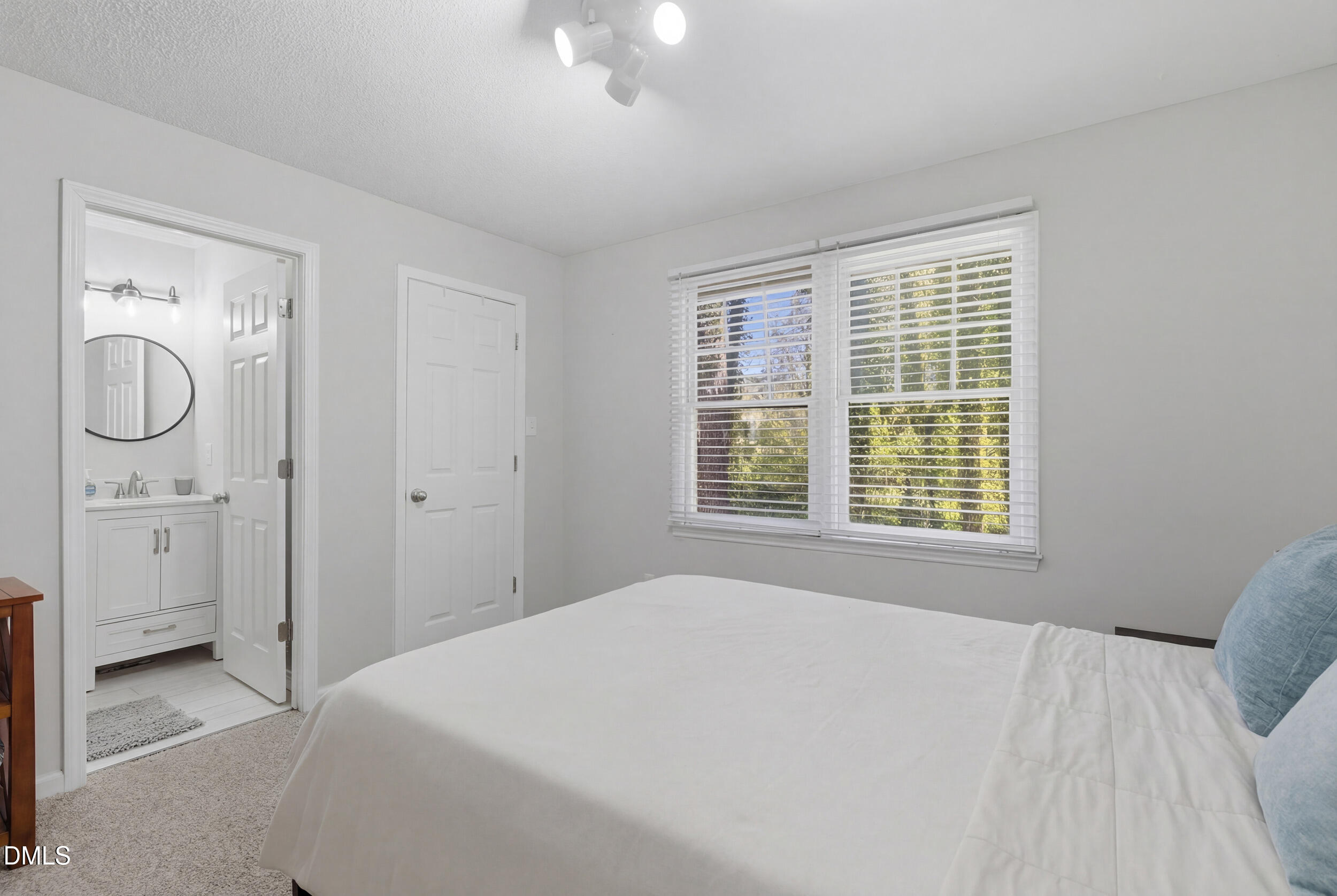725 Charleston Road Raleigh, NC 27606 - Photo 14 of 27 a bedroom with a bed and a window