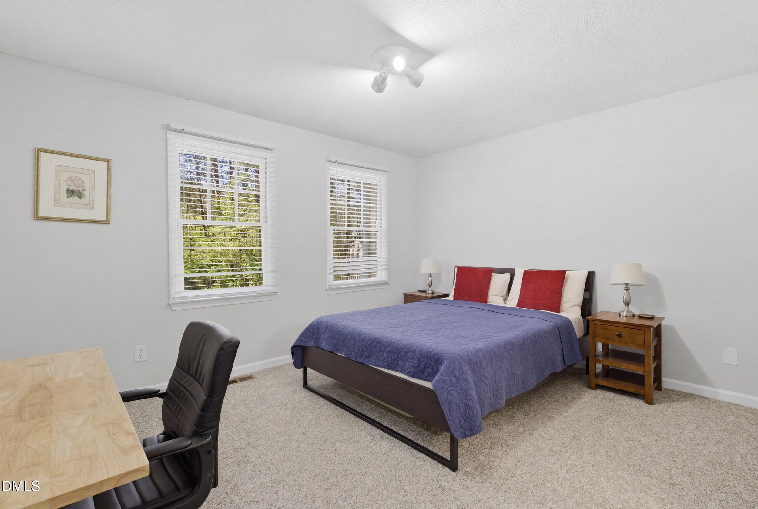 725 Charleston Road Raleigh, NC 27606 - Photo 18 of 27 a bedroom with a bed chair and a window