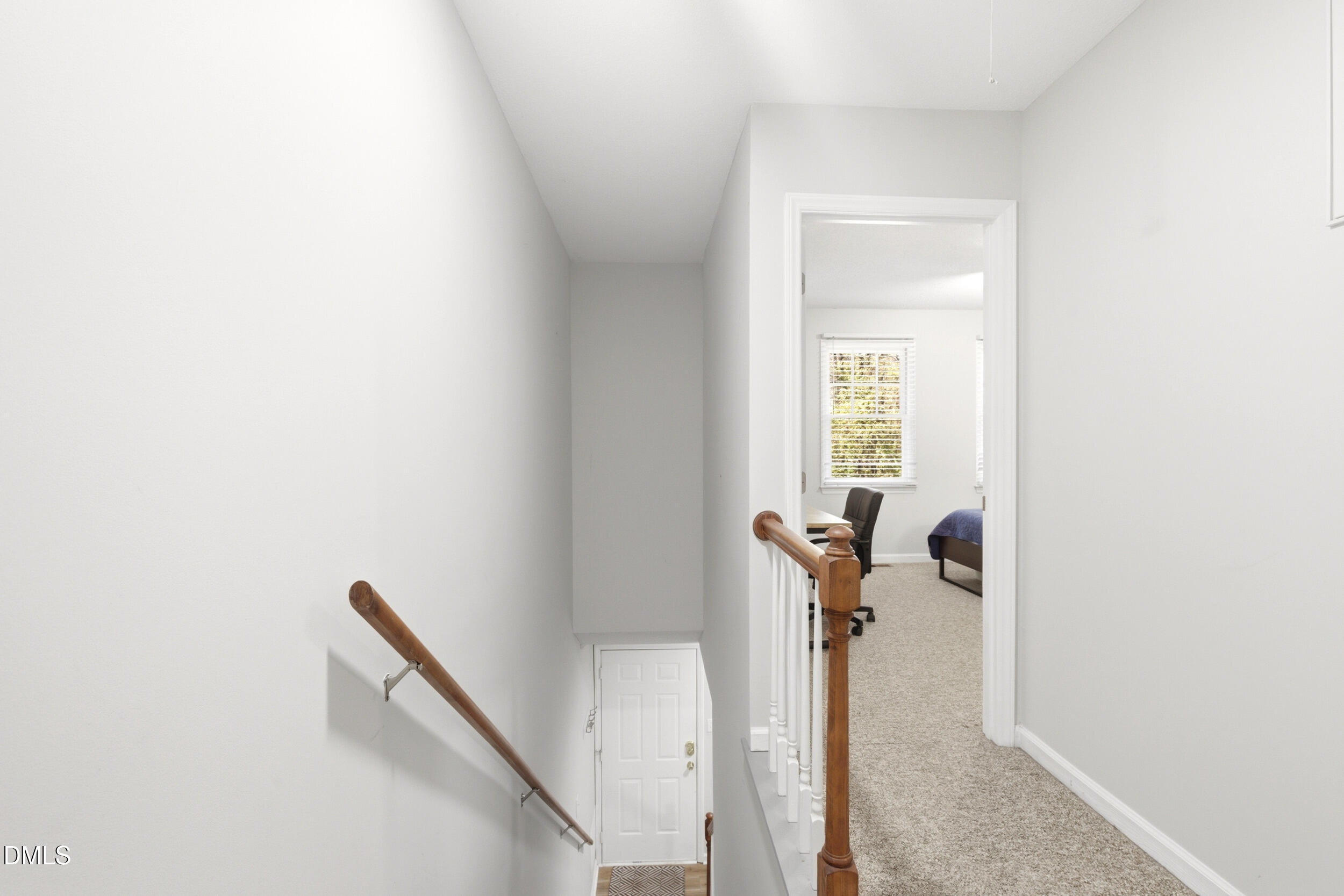 725 Charleston Road Raleigh, NC 27606 - Photo 23 of 27 a view of a hallway with furniture and stairs
