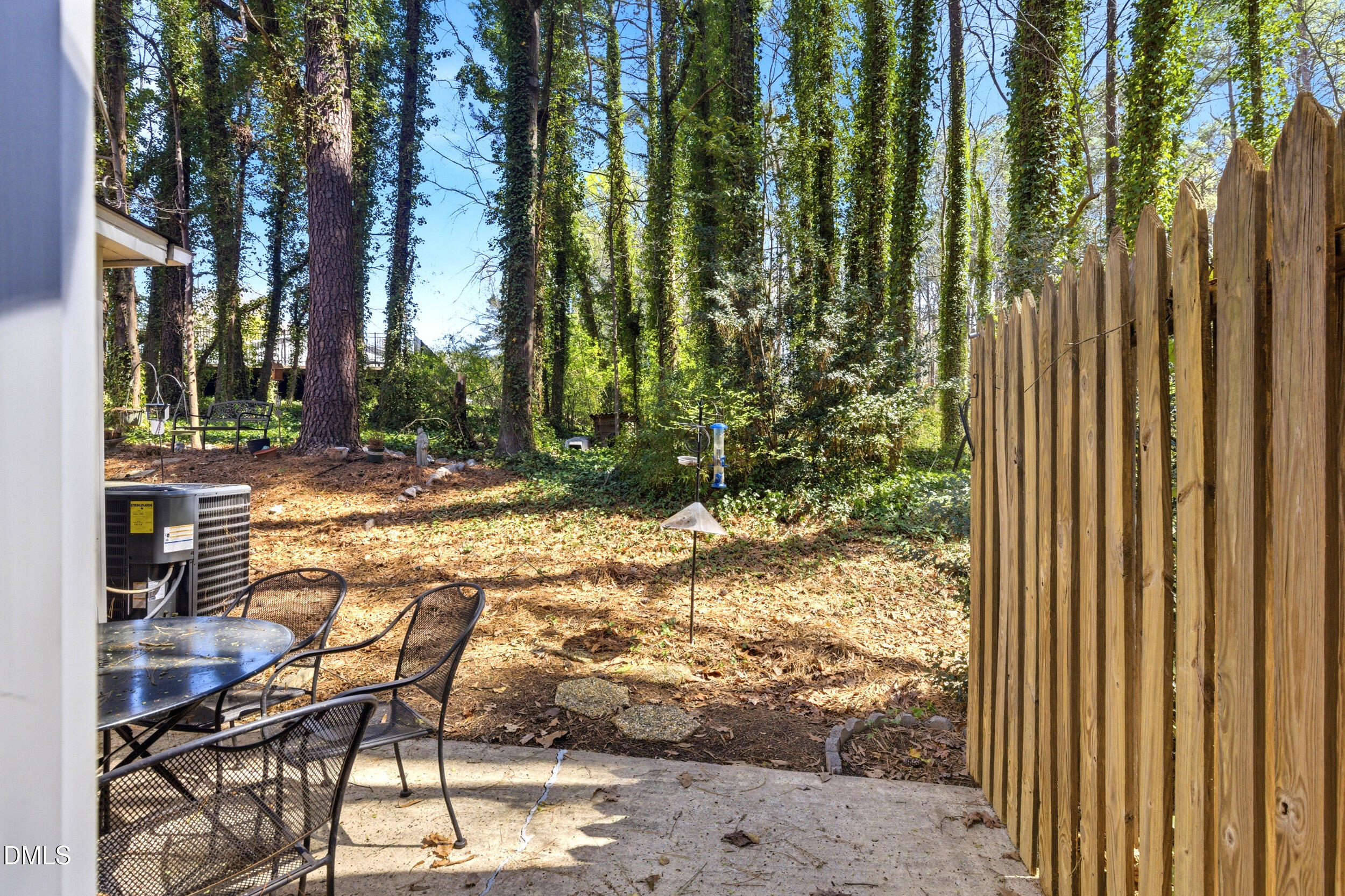 725 Charleston Road Raleigh, NC 27606 - Photo 26 of 27 a view of swimming pool with lawn chairs and wooden fence