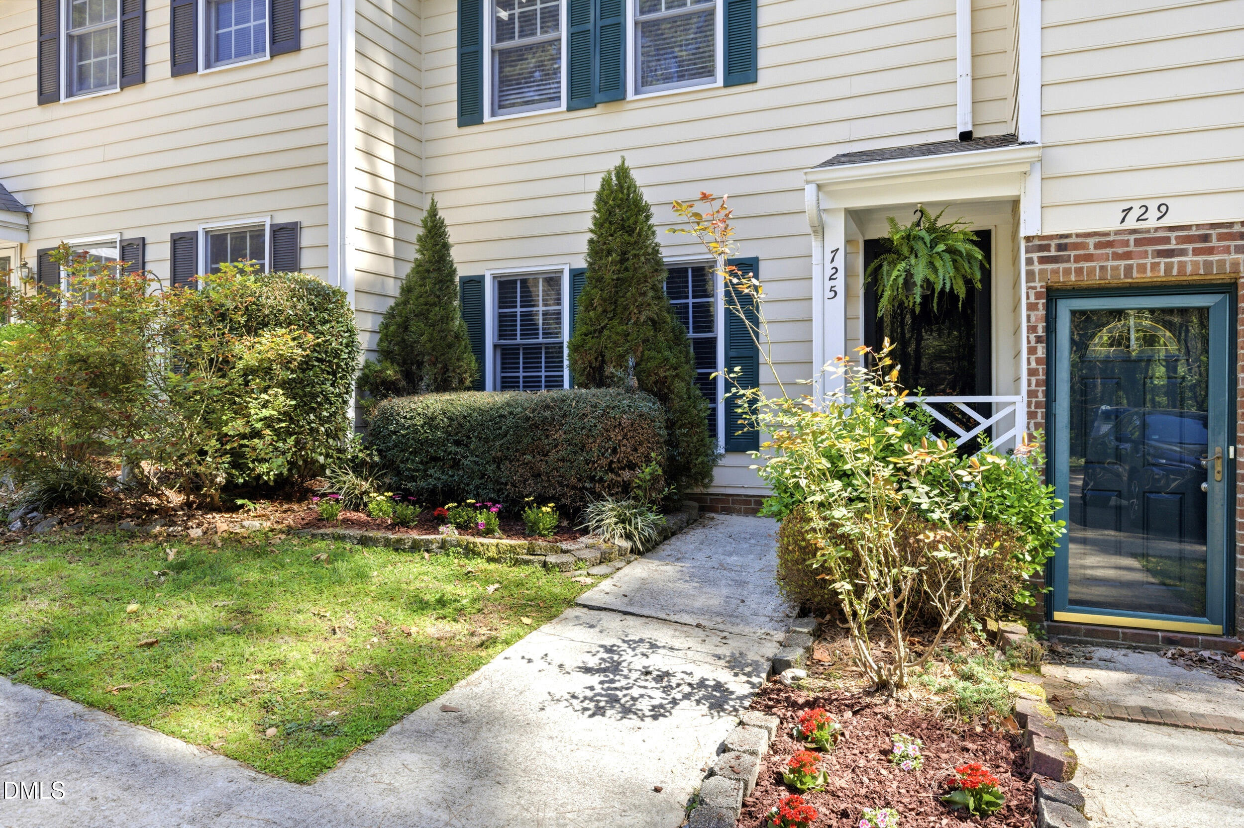 725 Charleston Road Raleigh, NC 27606 - Photo 2 of 27 a front view of a house with garden