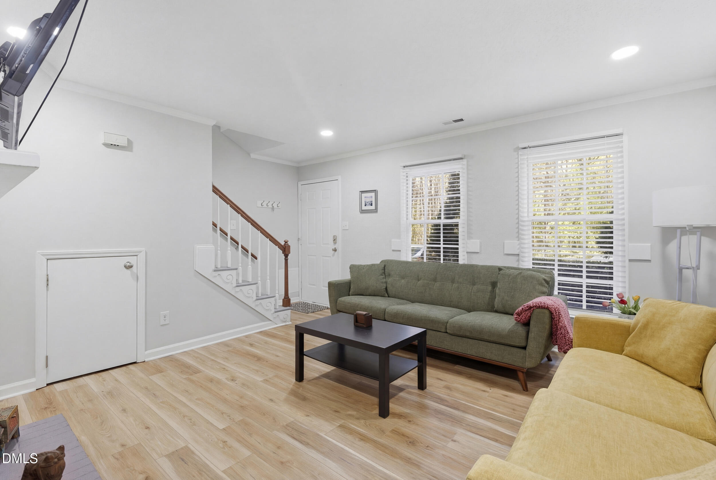 725 Charleston Road Raleigh, NC 27606 - Photo 5 of 27 a living room with furniture and a window