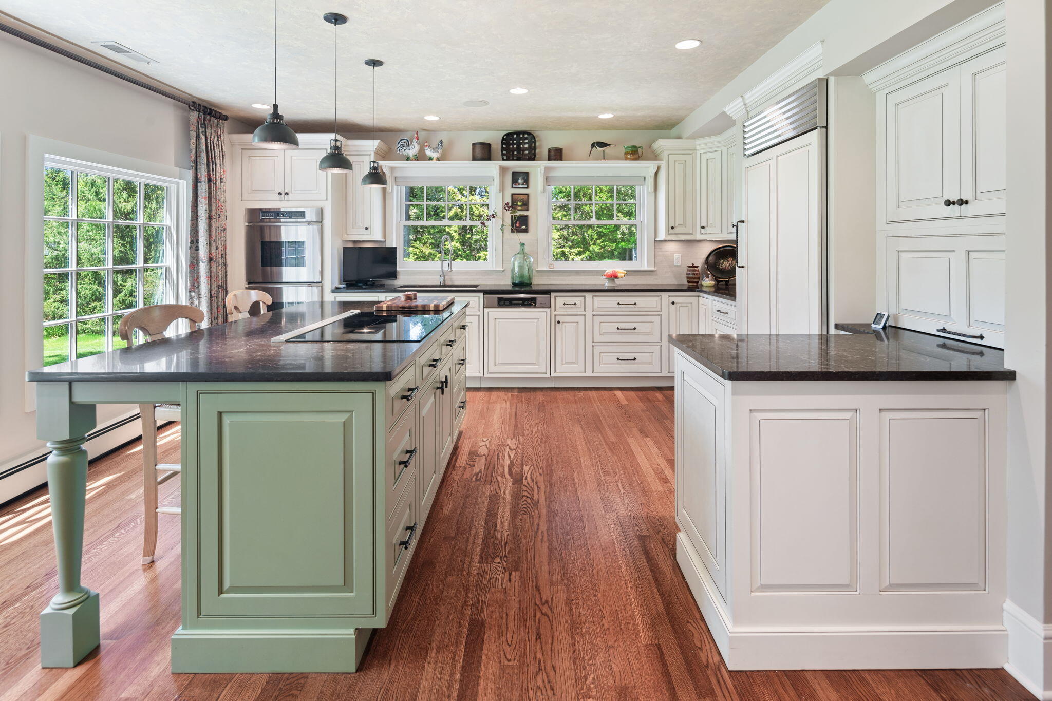 1466 Ponus Ridge Road New Canaan, CT 06840 - Photo 18 of 81 a kitchen with stainless steel appliances granite countertop a stove and a wooden floors