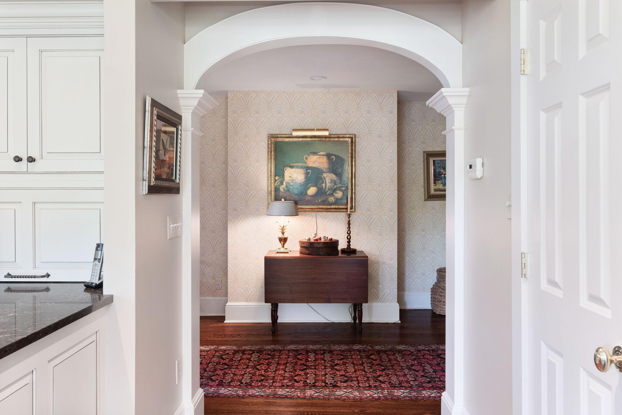 1466 Ponus Ridge Road New Canaan, CT 06840 - Photo 22 of 81 a view of a hallway with a dining table and chair