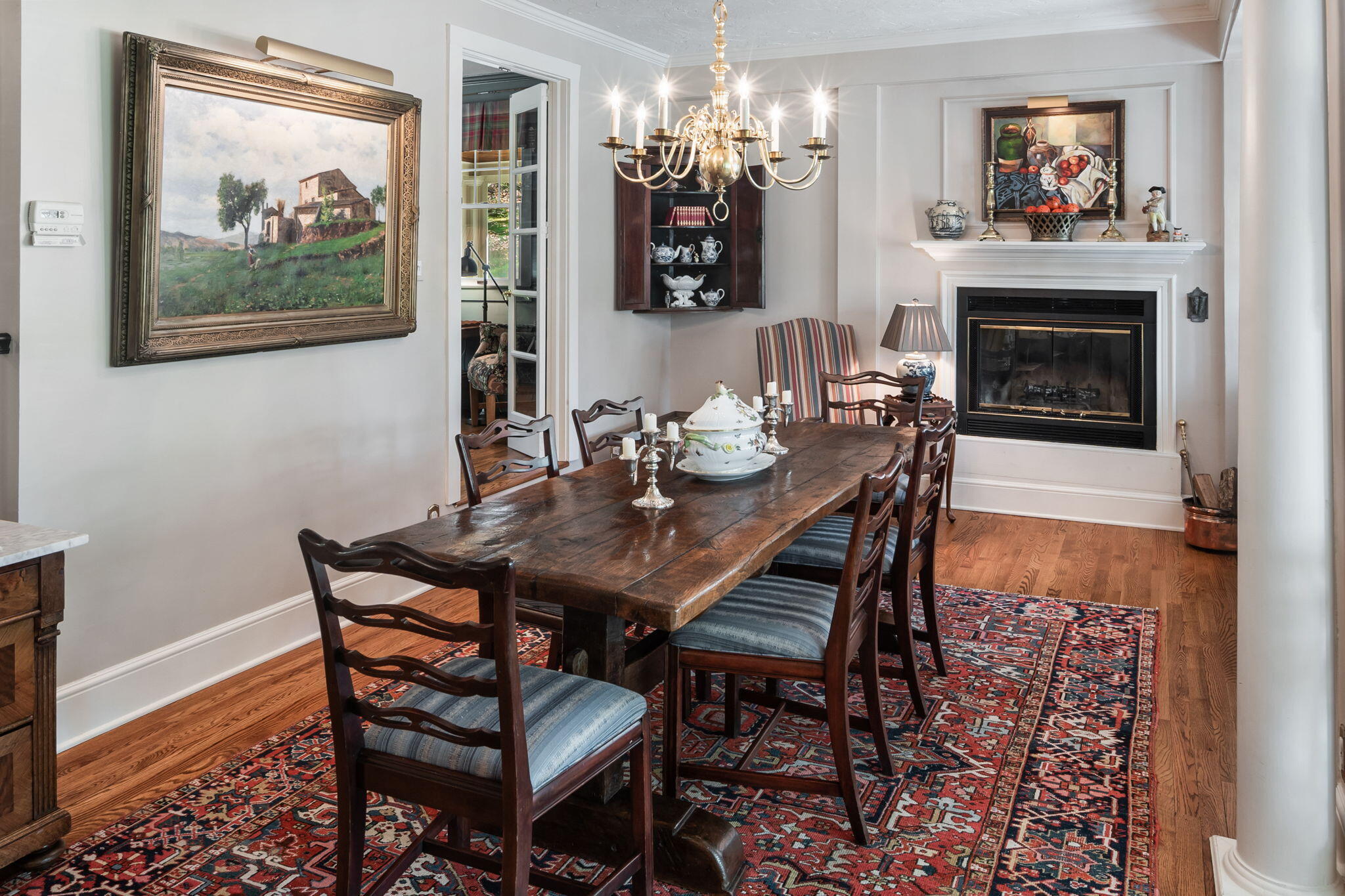 1466 Ponus Ridge Road New Canaan, CT 06840 - Photo 24 of 81 a dining room with furniture a chandelier and wooden floor