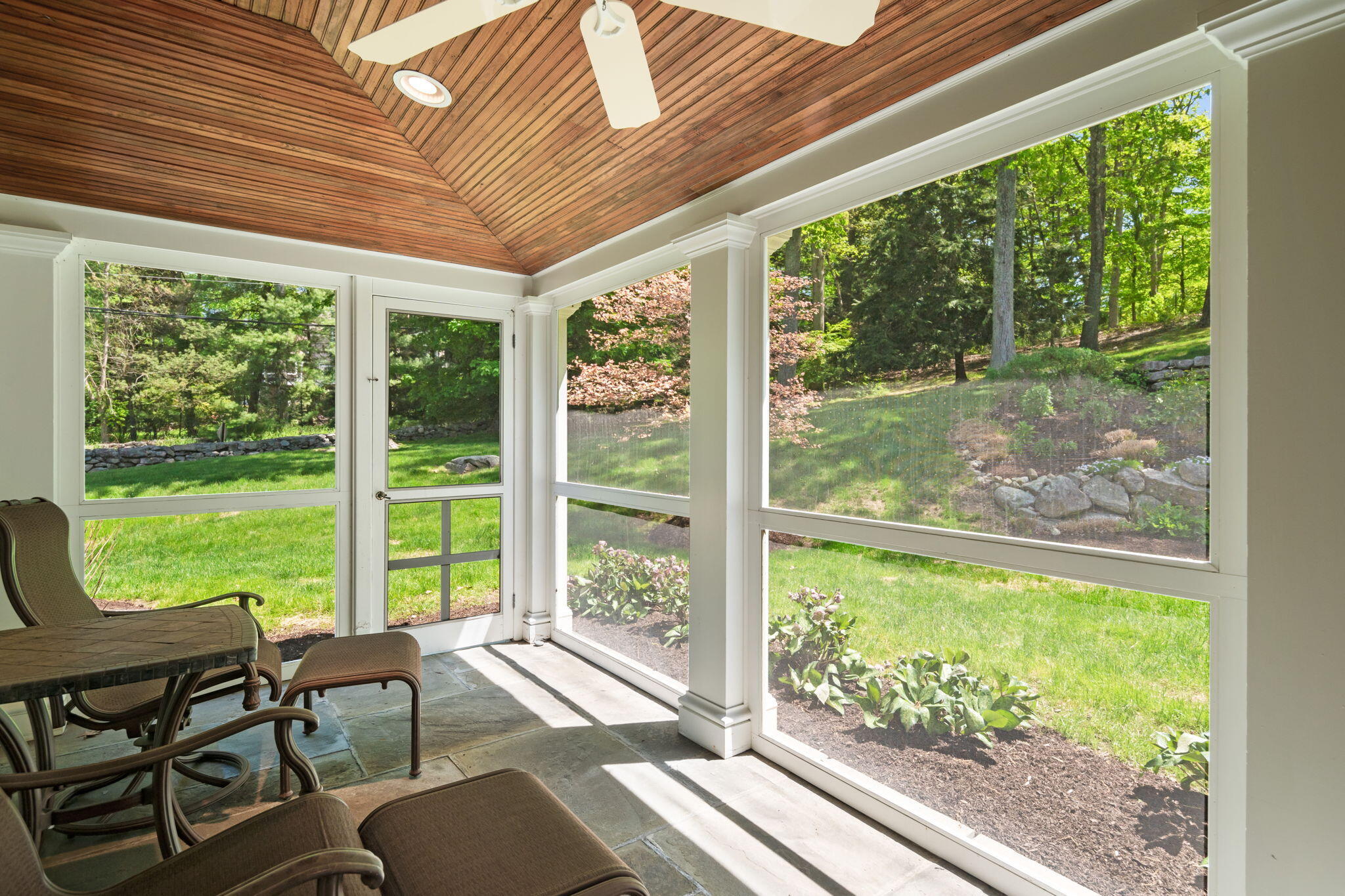 1466 Ponus Ridge Road New Canaan, CT 06840 - Photo 30 of 81 a living room with hardwood floor and large windows