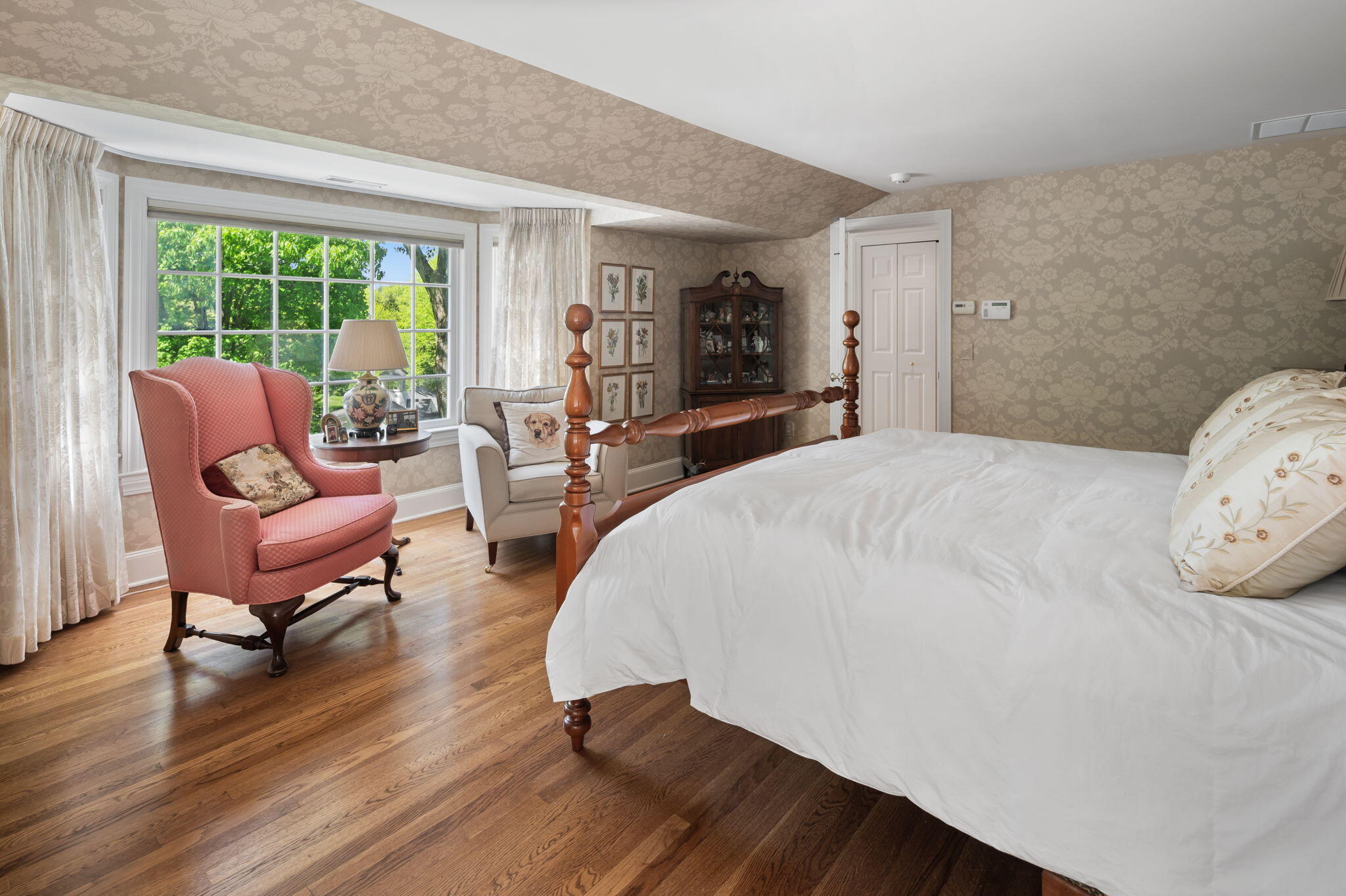 1466 Ponus Ridge Road New Canaan, CT 06840 - Photo 43 of 81 a spacious bedroom with a bed a couch and large window