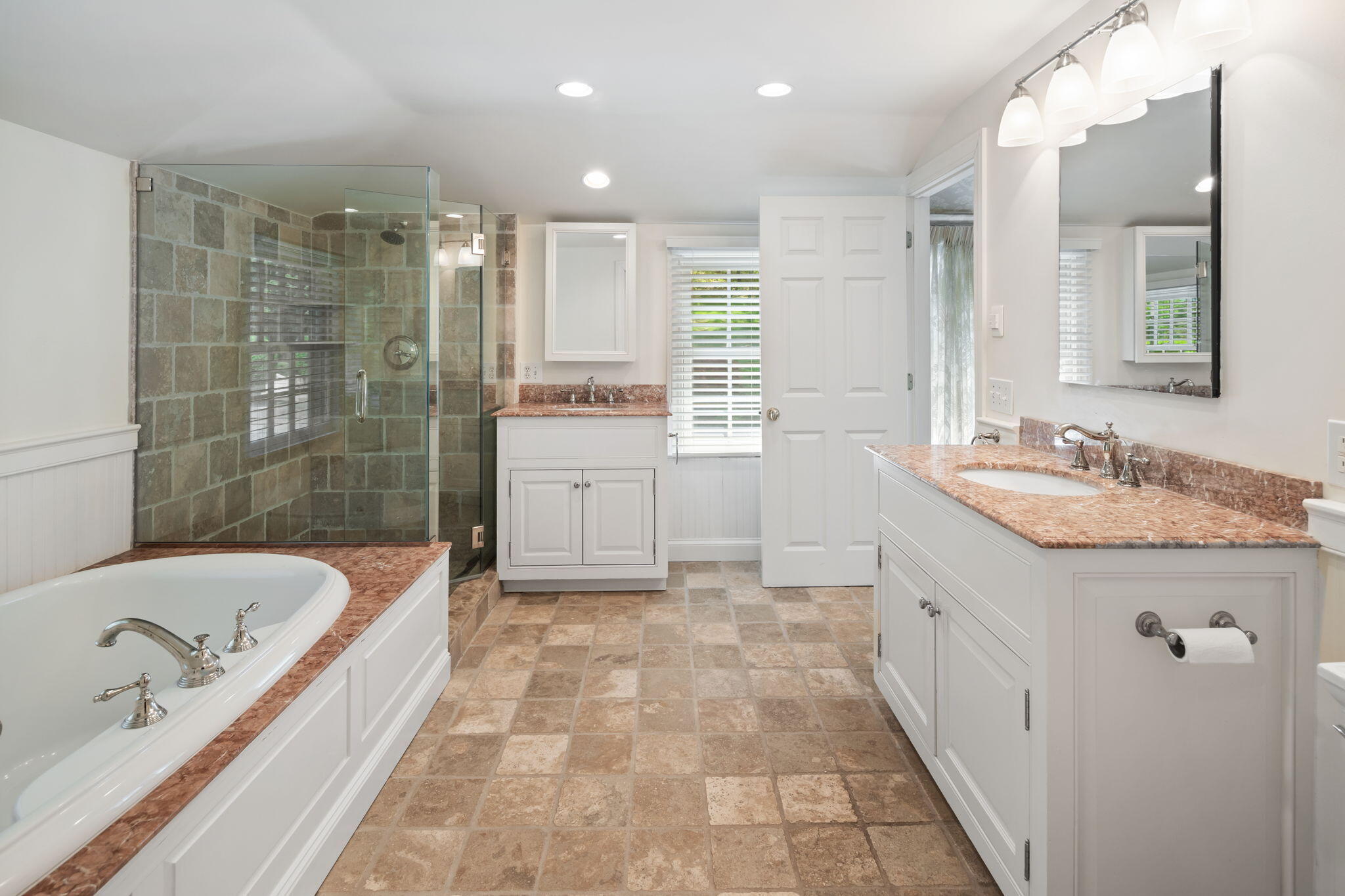 1466 Ponus Ridge Road New Canaan, CT 06840 - Photo 44 of 81 a bathroom with a tub sink and mirror