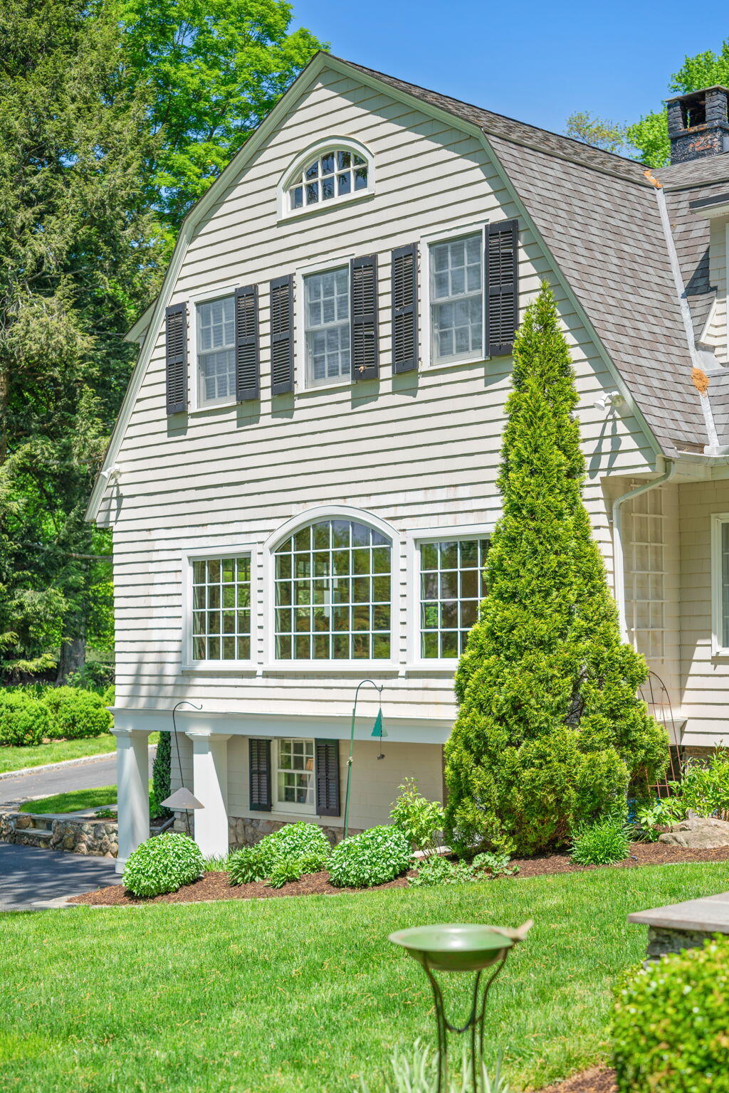 1466 Ponus Ridge Road New Canaan, CT 06840 - Photo 52 of 81 a front view of a house with a yard