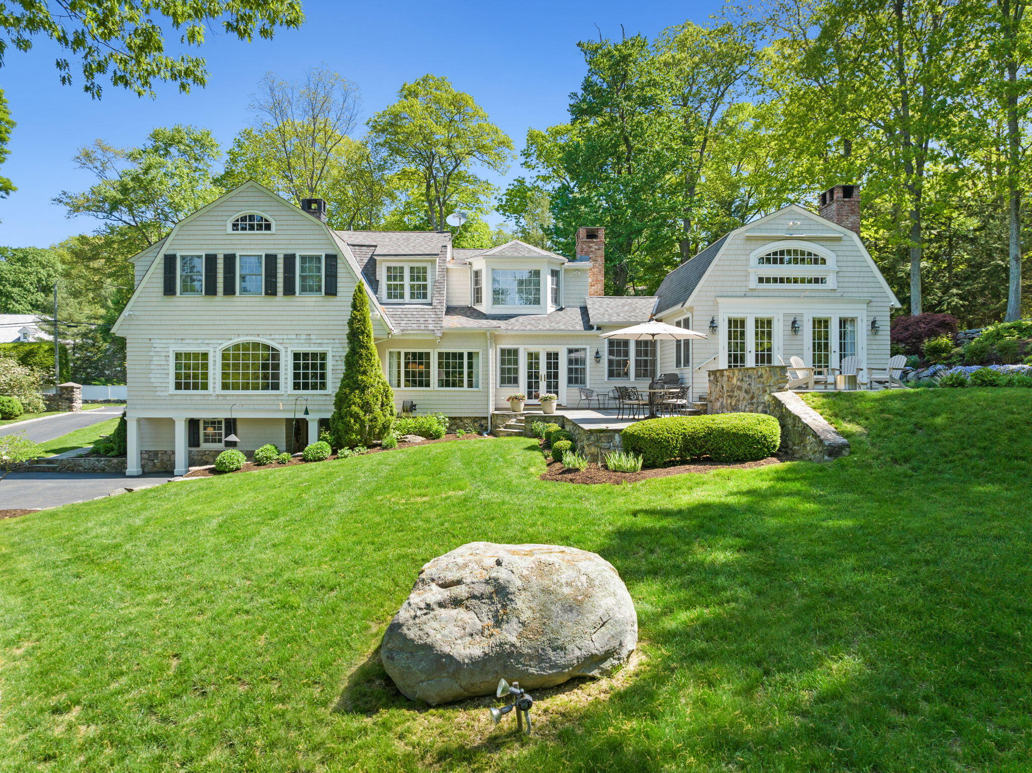 1466 Ponus Ridge Road New Canaan, CT 06840 - Photo 54 of 81 a front view of a house with a yard