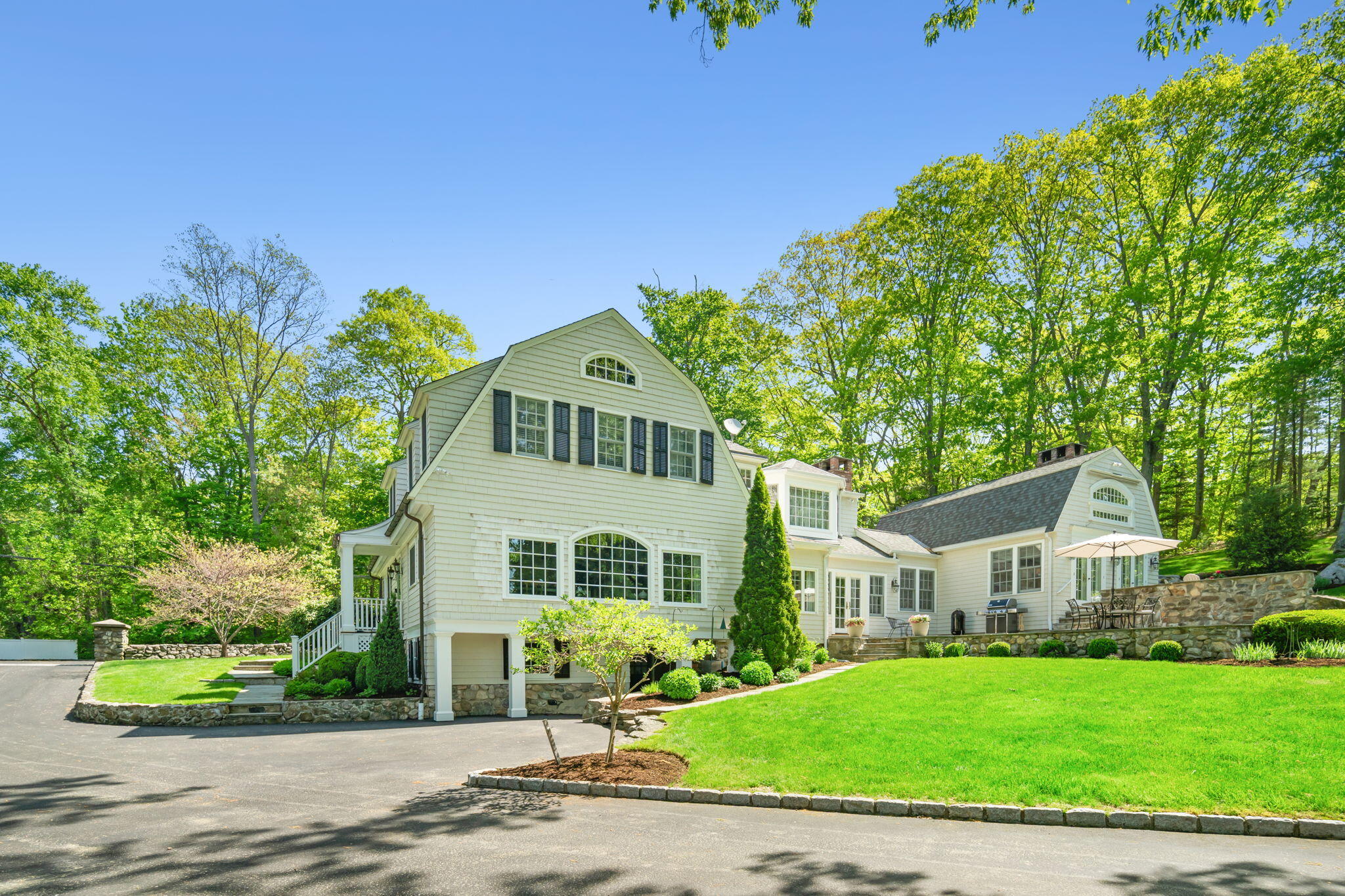 1466 Ponus Ridge Road New Canaan, CT 06840 - Photo 73 of 81 a front view of a house with a yard