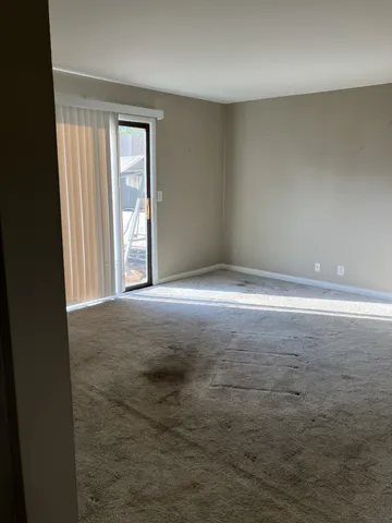 wooden floor and window in an empty room