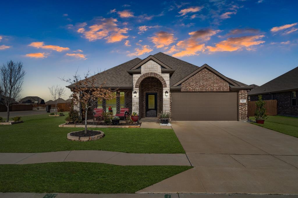 324 Jefferson Lane Fate, TX 75189 - Photo 1 of 1 a front view of a house with a garden and yard