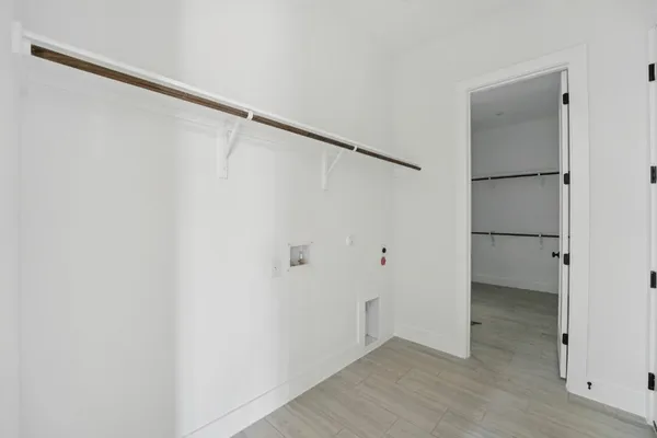 a view of a room with stairs and a ceiling fan