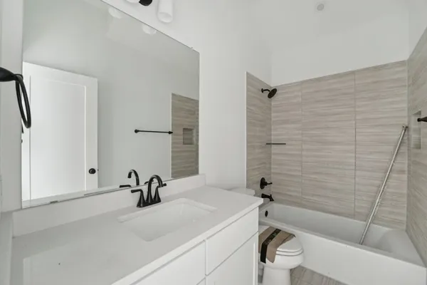 a bathroom with a sink and vanity
