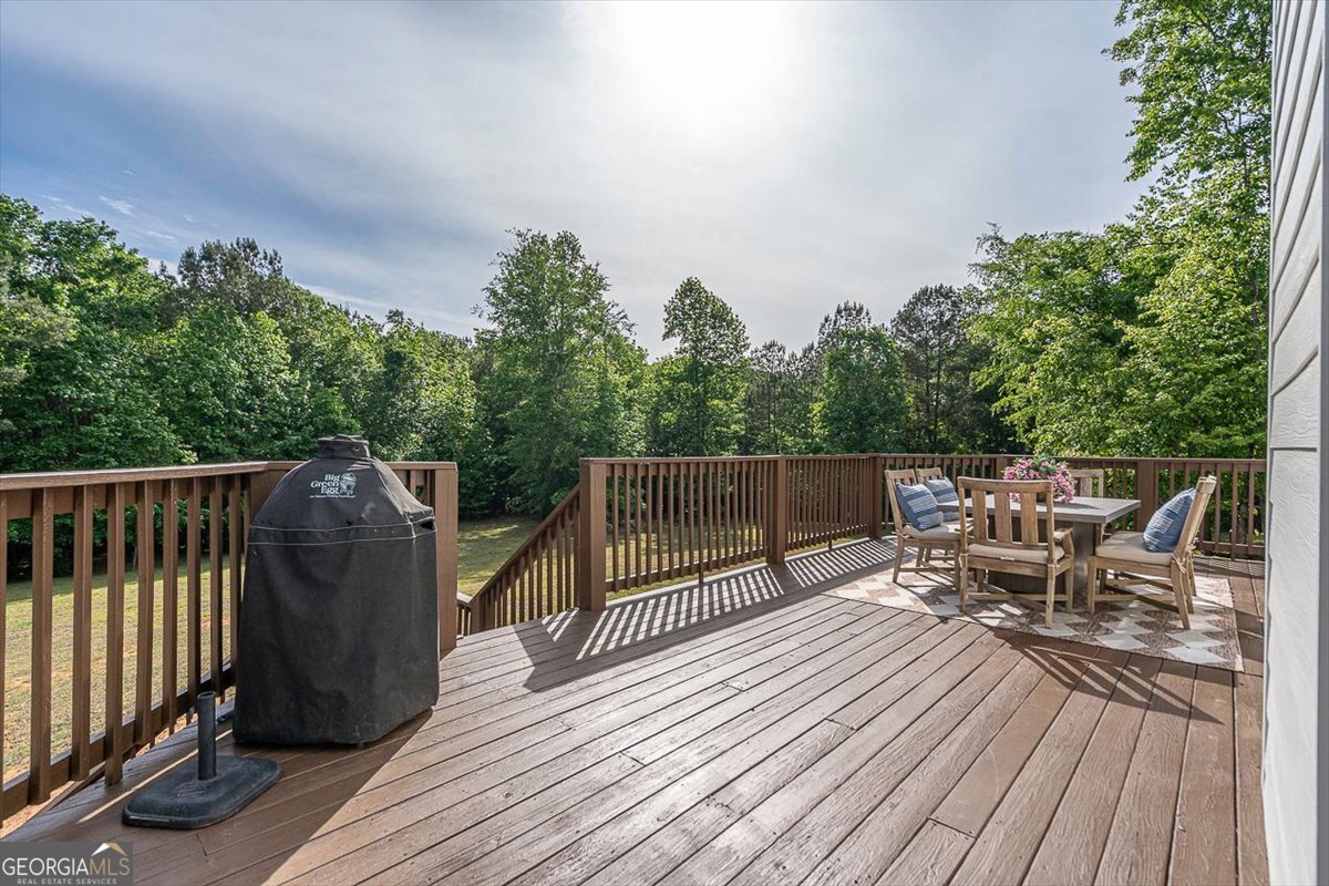3093 Surry Ridge Drive Watkinsville, GA 30677 - Photo 33 of 41 a view of a roof deck with wooden floor and fence