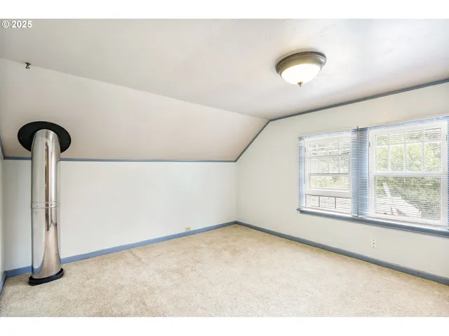 a big room with windows and closet