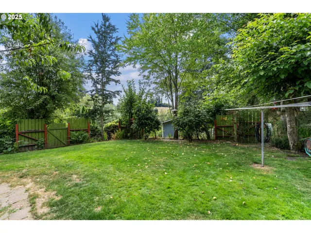 a backyard of a house with lots of green space