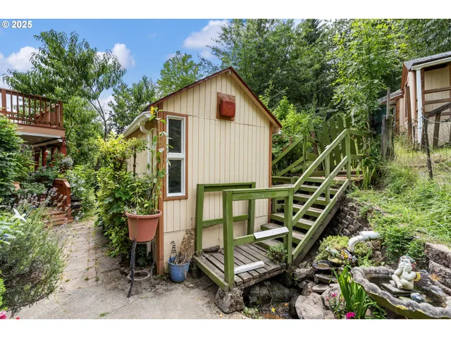 a view of a house with a wooden deck
