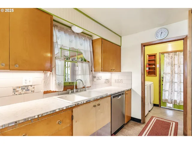 a open kitchen with stainless steel appliances kitchen island granite countertop a sink and cabinets