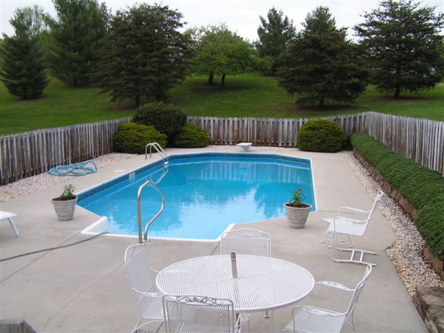 115 Stonebridge Drive Blue Ridge, VA 24064 - Photo 4 of 64 a view of a table and chairs in the patio