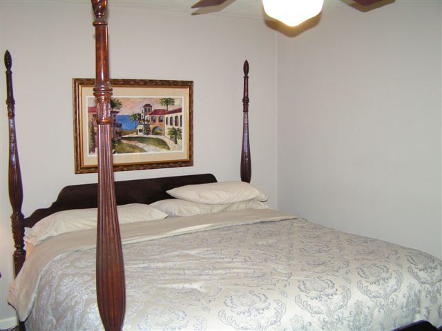 115 Stonebridge Drive Blue Ridge, VA 24064 - Photo 35 of 64 a bedroom with a bed and glass door