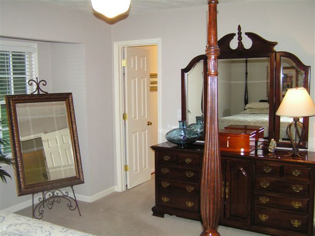 115 Stonebridge Drive Blue Ridge, VA 24064 - Photo 36 of 64 a view of a hallway with a mirror and furniture