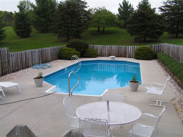 115 Stonebridge Drive Blue Ridge, VA 24064 - Photo 5 of 64 a backyard of a house with table and chairs