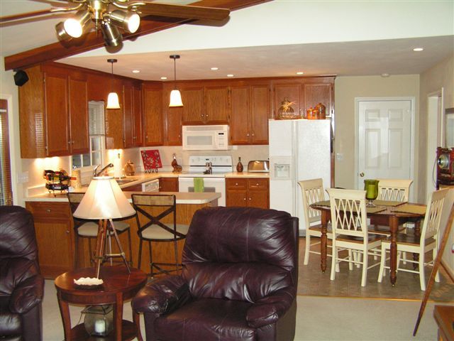 115 Stonebridge Drive Blue Ridge, VA 24064 - Photo 41 of 64 a living room with stainless steel appliances kitchen island granite countertop furniture and a large window