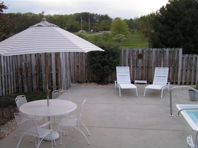 115 Stonebridge Drive Blue Ridge, VA 24064 - Photo 58 of 64 a backyard of a house with table and chairs