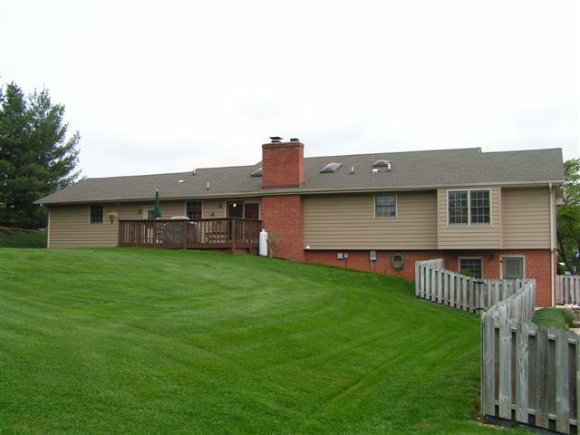 115 Stonebridge Drive Blue Ridge, VA 24064 - Photo 9 of 64 a view of a house with a backyard