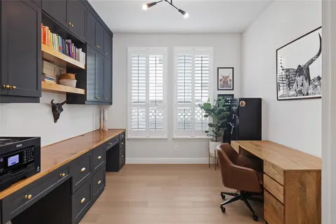a workspace with furniture and a window
