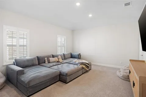 a bedroom with bed and a window