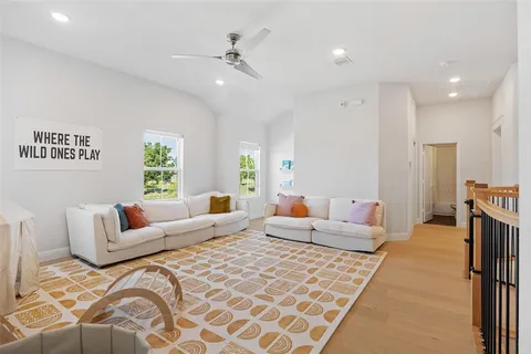 a bedroom with furniture and a large window