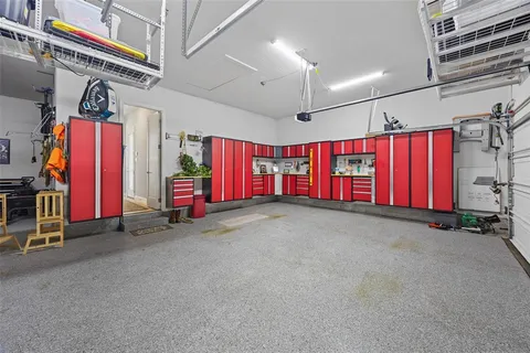 an empty room with furniture air conditioner and windows