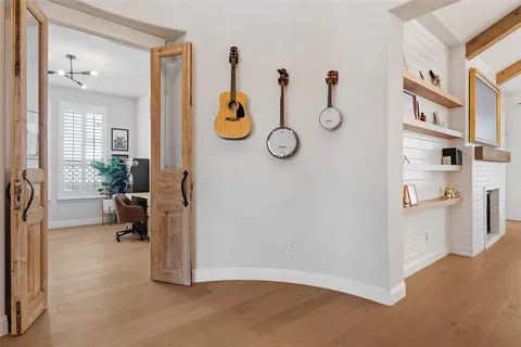 a view of living room filled with furniture and a window