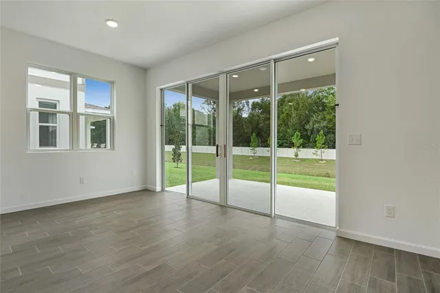 a view of an empty room with glass door