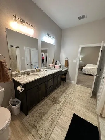 a living room with furniture and a lamp