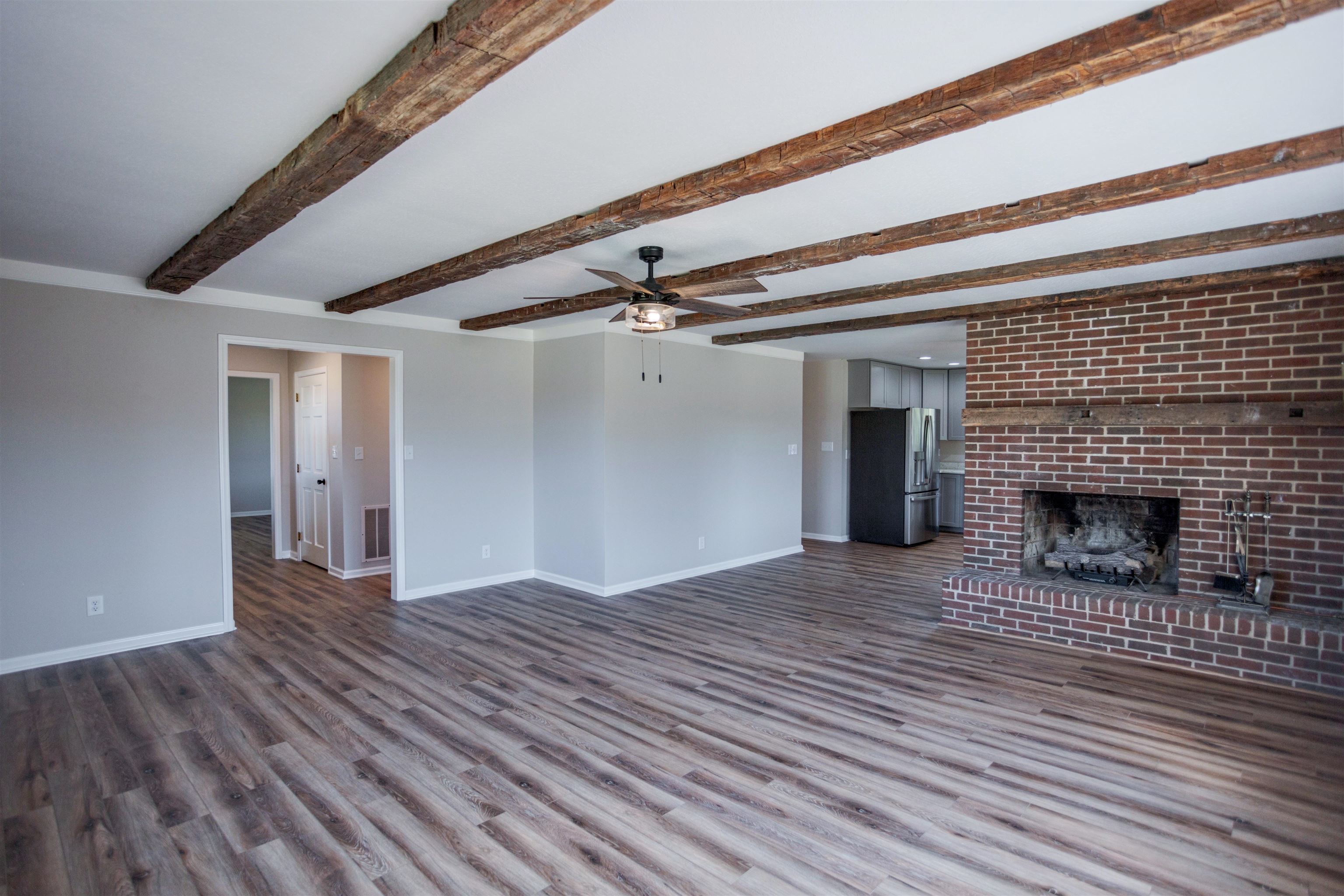 2834 Brownsburg Turnpike Raphine, VA 24472 - Photo 11 of 69 a view of empty room with wooden floor and fireplace