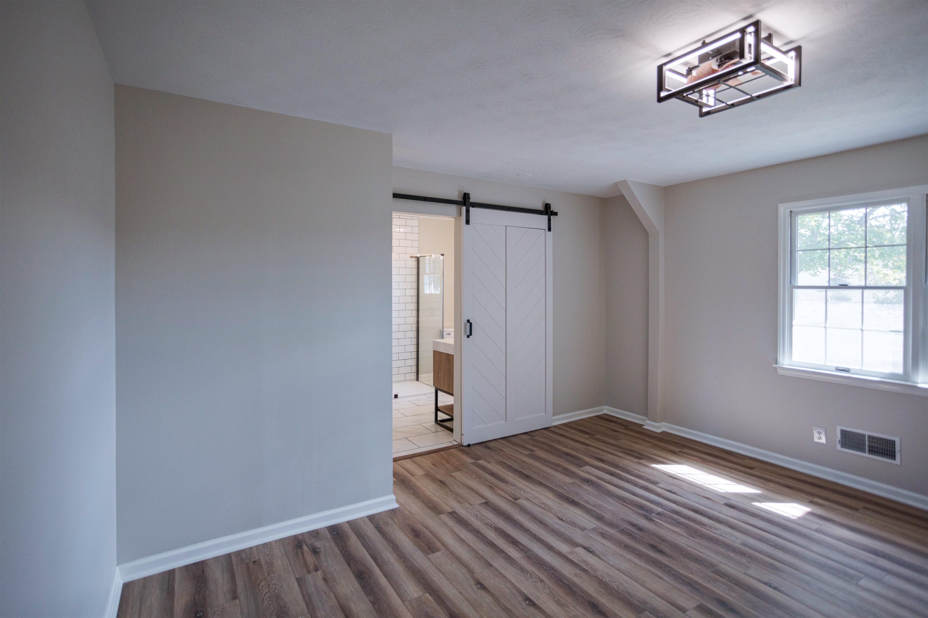 2834 Brownsburg Turnpike Raphine, VA 24472 - Photo 15 of 38 wooden floor in an empty room with a window