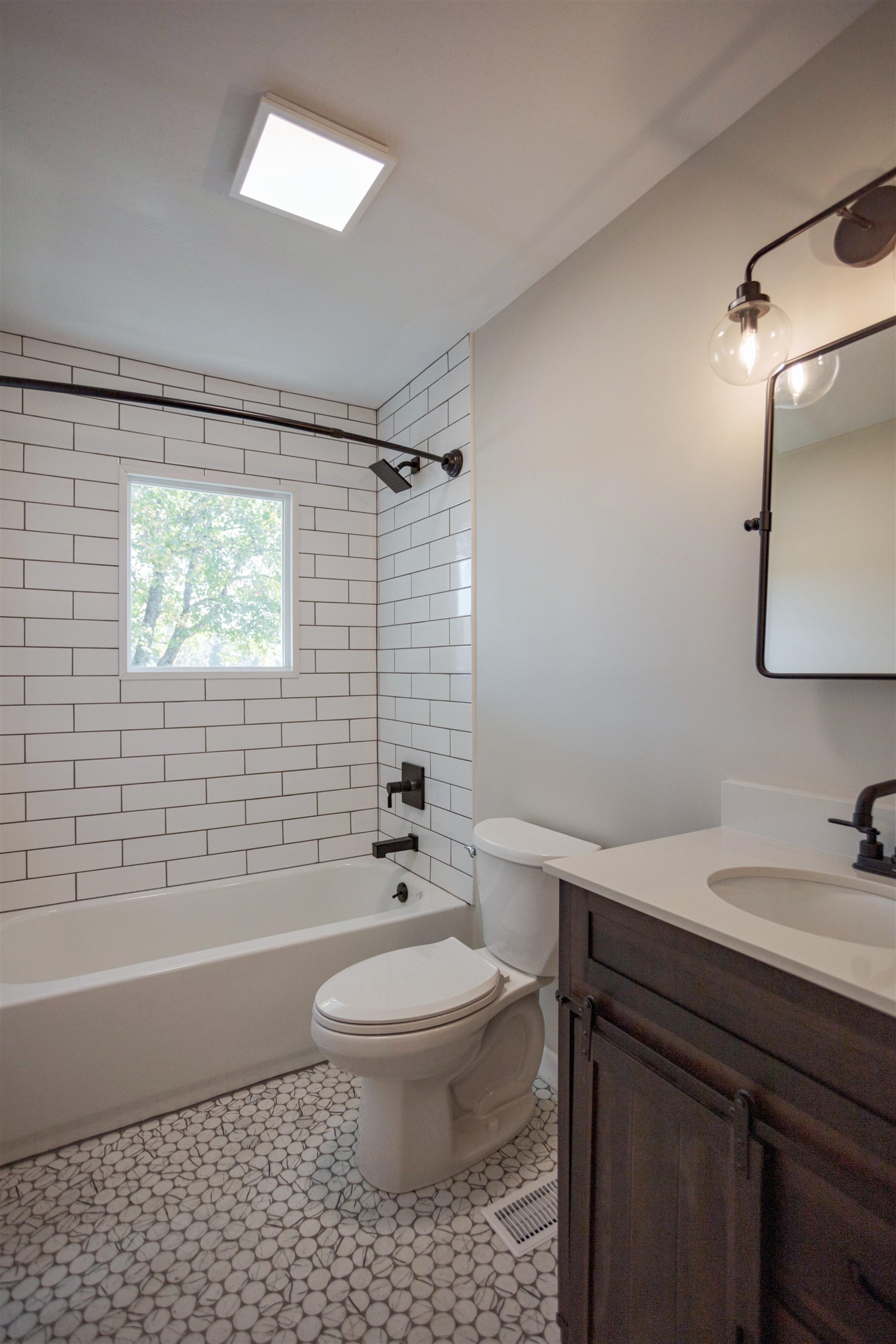 2834 Brownsburg Turnpike Raphine, VA 24472 - Photo 20 of 38 a bathroom with a sink a toilet and shower