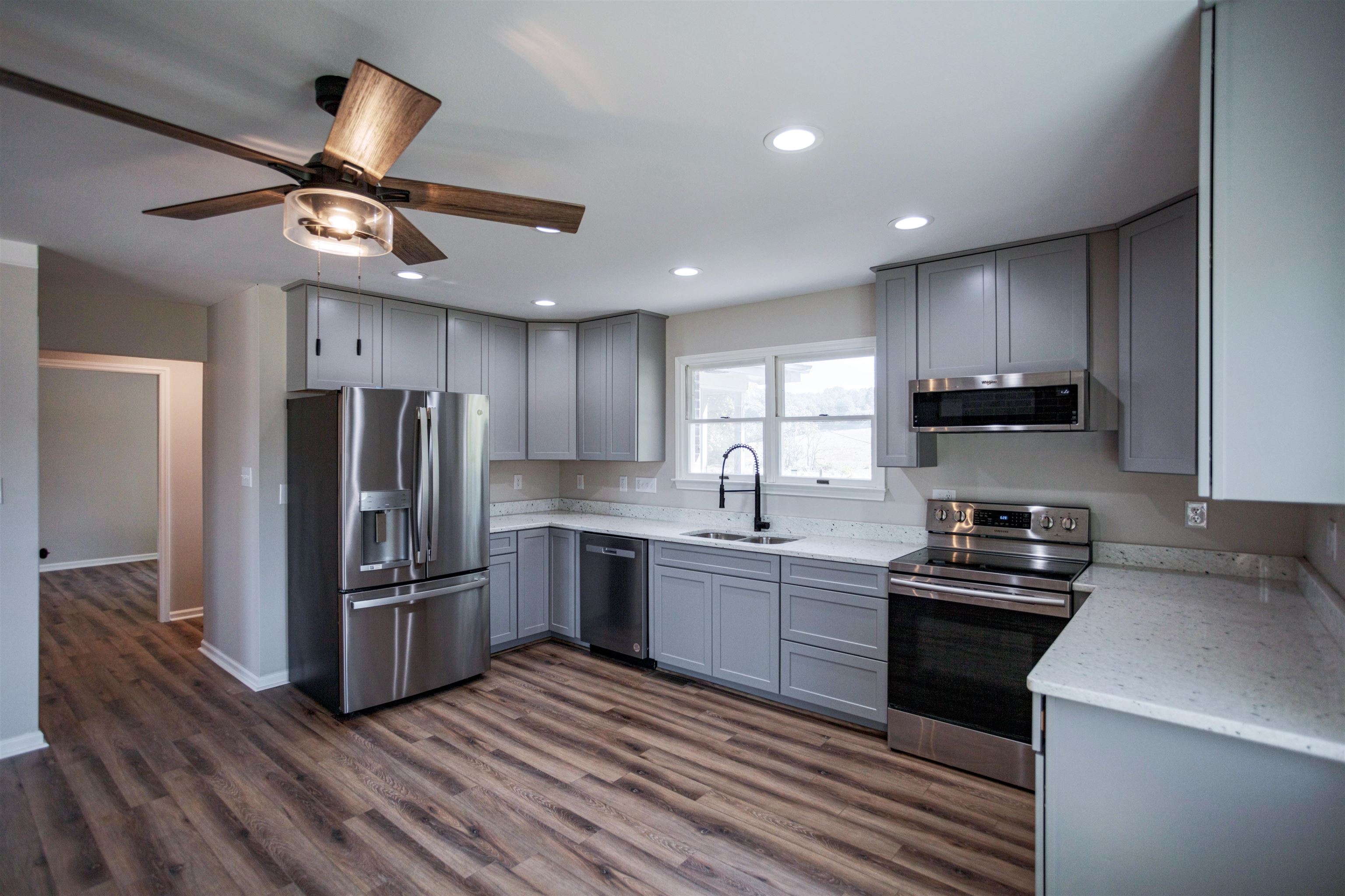 2834 Brownsburg Turnpike Raphine, VA 24472 - Photo 8 of 69 a kitchen with granite countertop stainless steel appliances cabinets a sink and a window