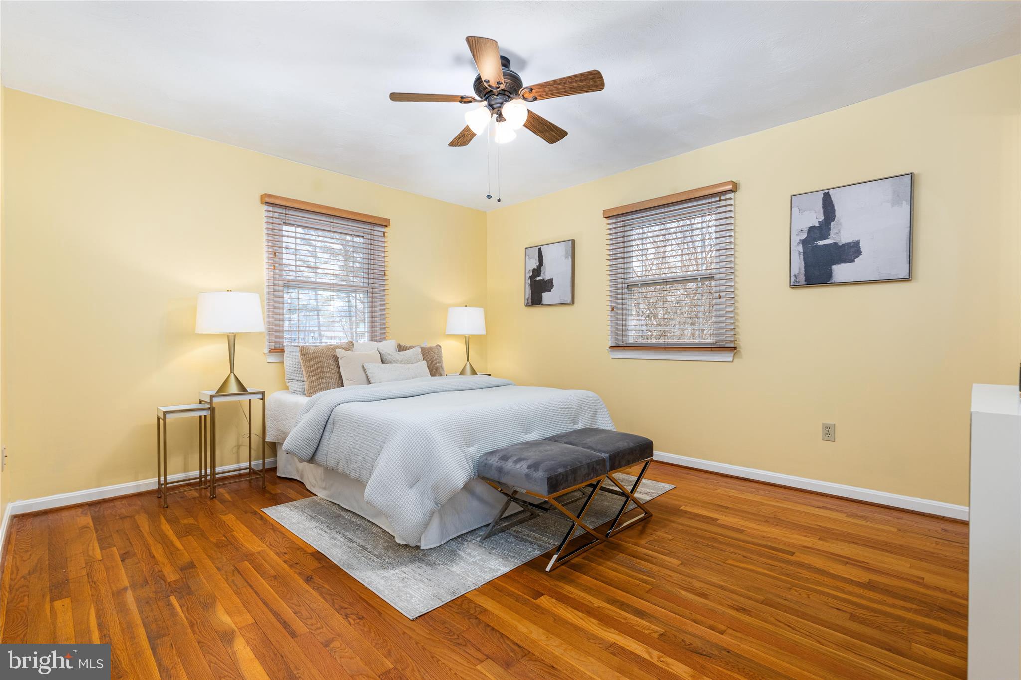7398 Roxbury Avenue Manassas, VA 20109 - Photo 16 of 75 a spacious bedroom with a bed and wooden floor