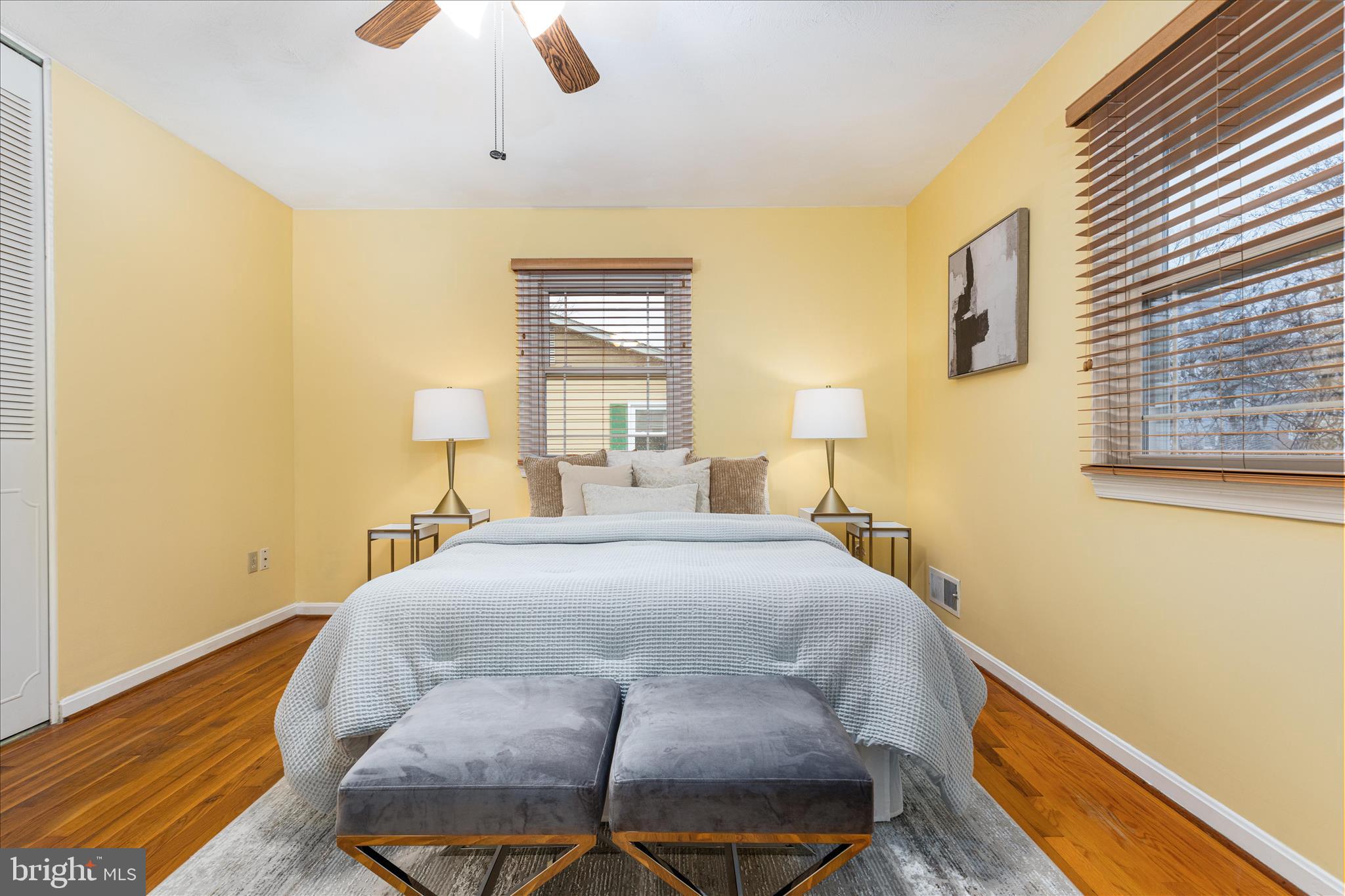 7398 Roxbury Avenue Manassas, VA 20109 - Photo 17 of 75 a bedroom with a bed and wooden floor