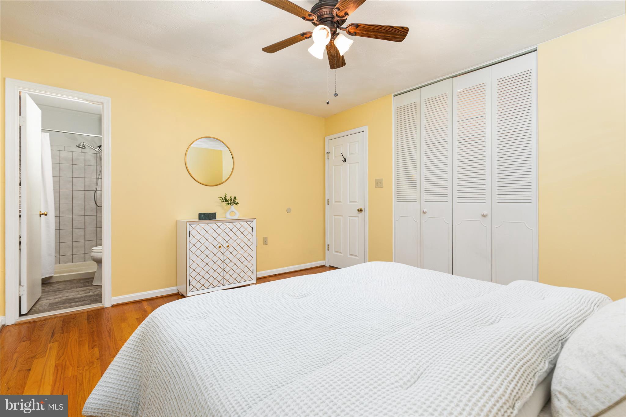 7398 Roxbury Avenue Manassas, VA 20109 - Photo 18 of 75 a bedroom with a bed and a chandelier
