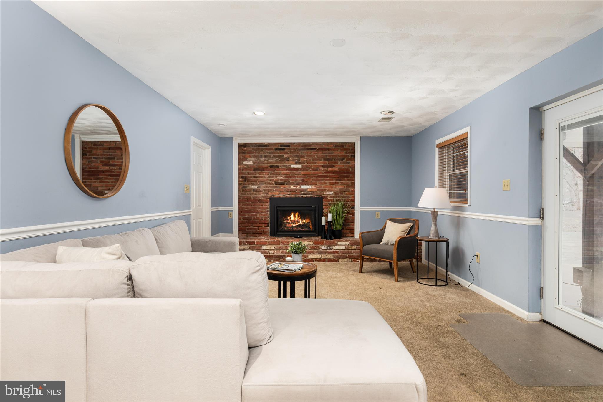 7398 Roxbury Avenue Manassas, VA 20109 - Photo 24 of 75 a living room with furniture and a fireplace