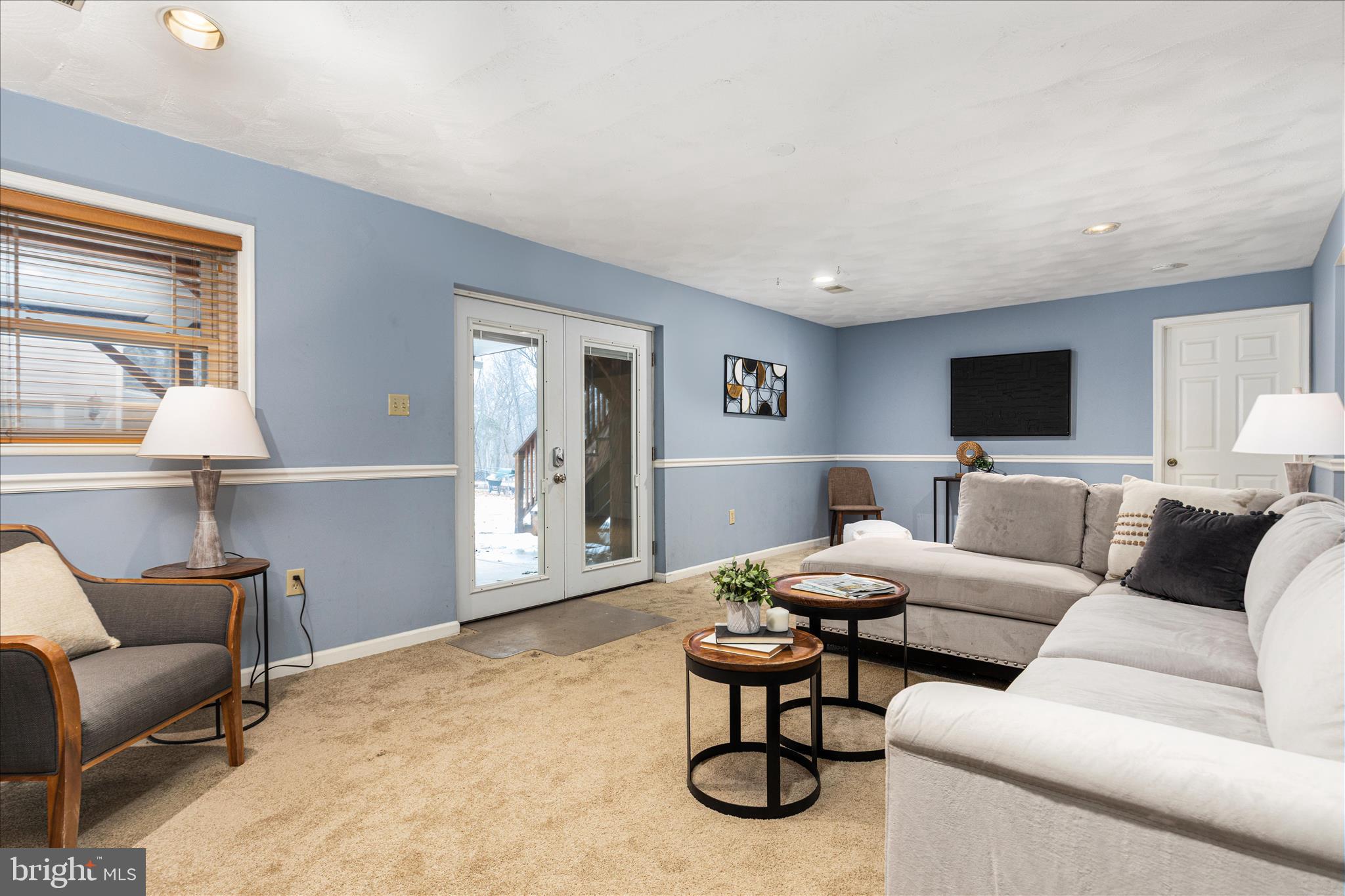 7398 Roxbury Avenue Manassas, VA 20109 - Photo 26 of 75 a living room with furniture and a flat screen tv