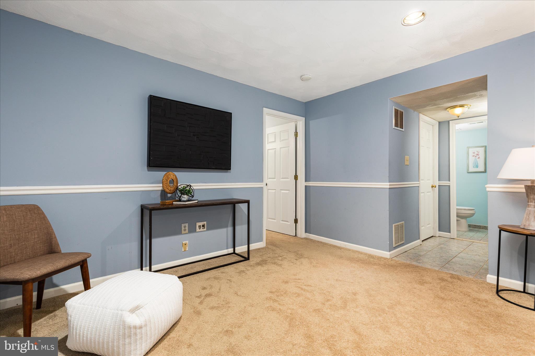 7398 Roxbury Avenue Manassas, VA 20109 - Photo 28 of 75 a living room with furniture and a flat screen tv