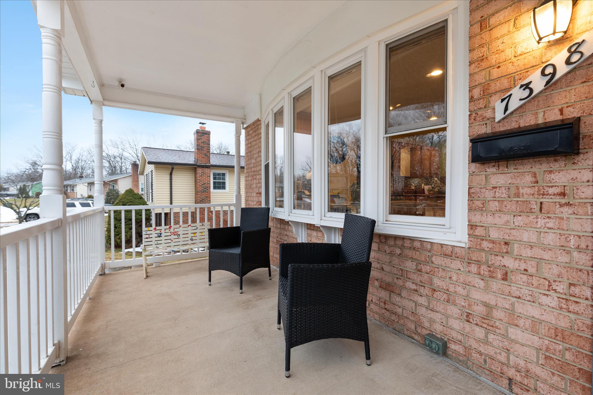 7398 Roxbury Avenue Manassas, VA 20109 - Photo 35 of 75 a balcony with furniture and a window