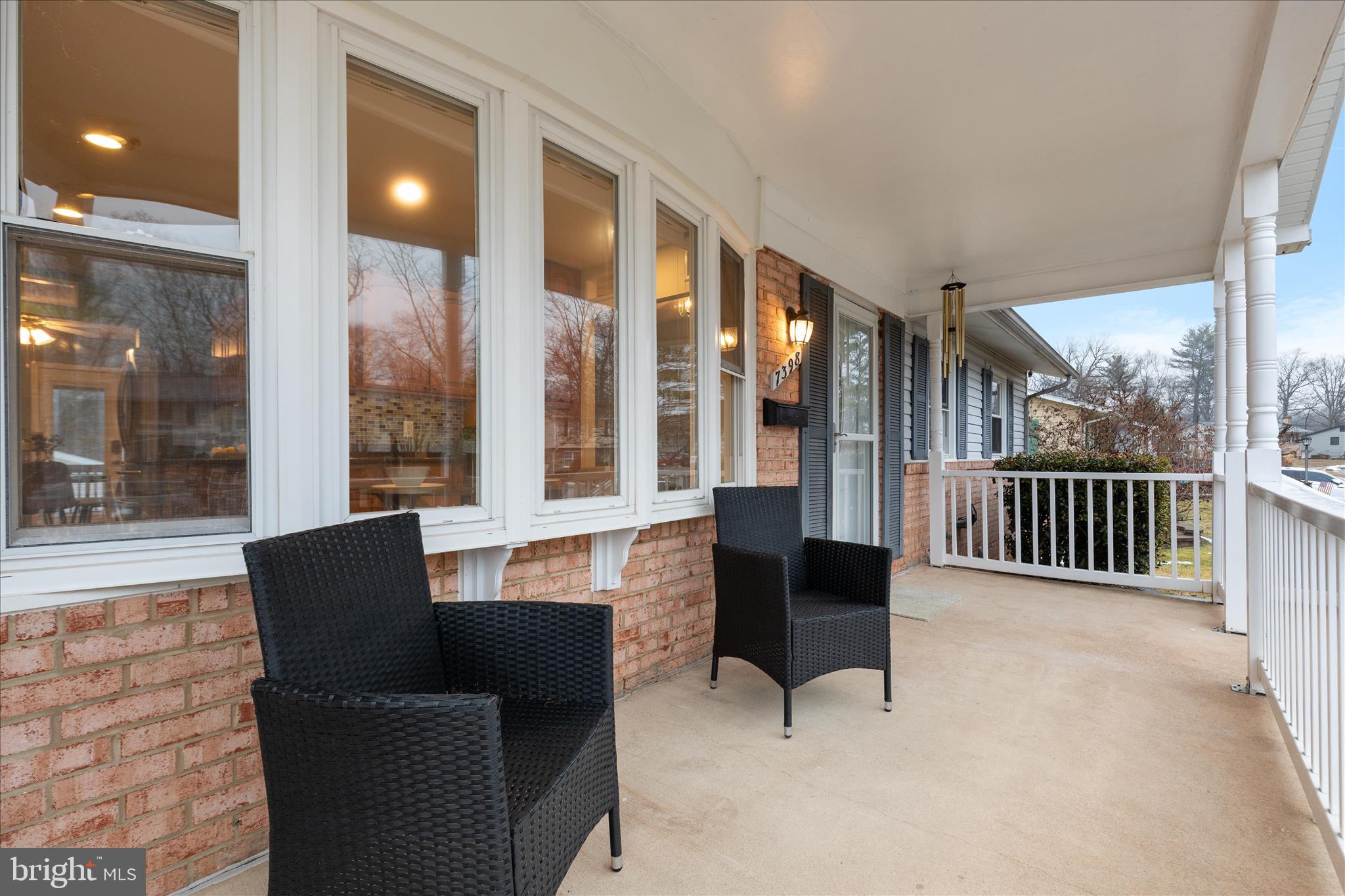 7398 Roxbury Avenue Manassas, VA 20109 - Photo 36 of 75 a living room with furniture and a floor to ceiling window